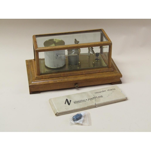 50 - A Negretti & Zambra barograph named 'The Regency' and sold in 1975, the chamber having 12 fold bello... 