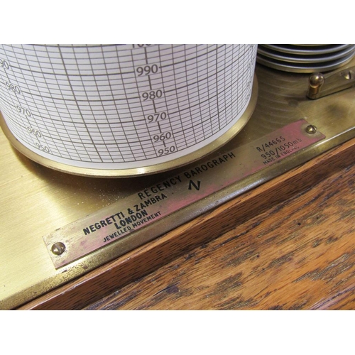 50 - A Negretti & Zambra barograph named 'The Regency' and sold in 1975, the chamber having 12 fold bello... 