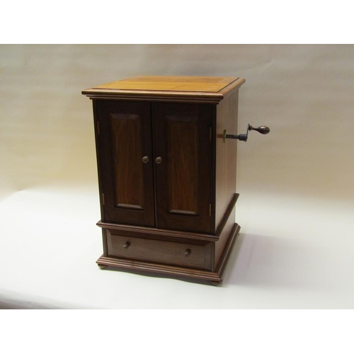 57 - An early 20c German Polyphon by Schutz Marke in a mahogany cabinet case with front opening doors and... 