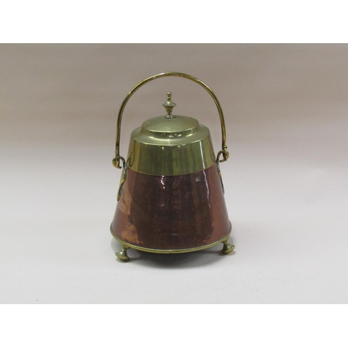 60 - A 19c Dutch copper and brass milk can of circular tapering form with a swing handle and supported on... 