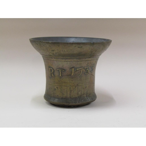 62 - An 18c bell metal mortar, cast 'RT 1733', with a 24cm  mouth, 20cm h.