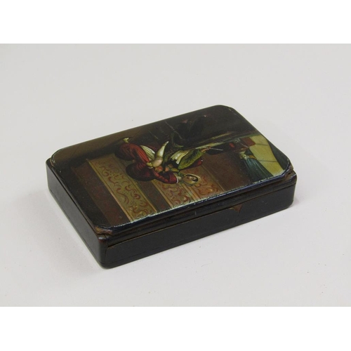 75 - An early 19c papier maché painted table snuff box with a semi erotic scene of a gentleman and a lady... 