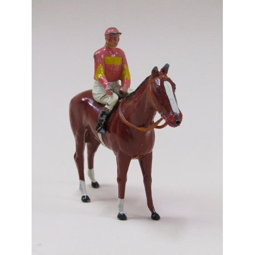 82 - A W Britain cold painted metal figure group of horse and jockey in Lord Rosebery colours, being mode... 