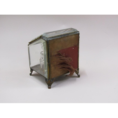 87 - A late Victorian glass scent bottle stand containing three glass bottles, with bevel edge glass wind... 