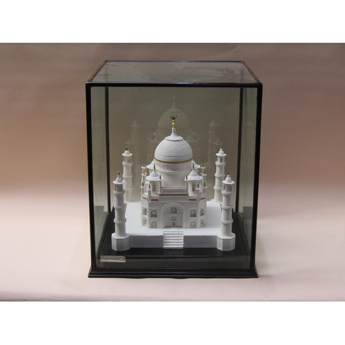 90 - A white sugar model of the Taj Mahal, on base, 38cm sq., 40cm h. in glass case.