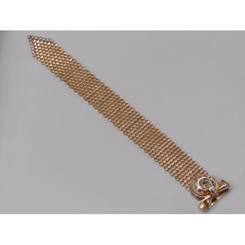 95 - A Jaeger Le Coultre gold bracelet watch in the form of a belt buckle, diamond set to the hinge watch... 