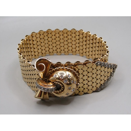 95 - A Jaeger Le Coultre gold bracelet watch in the form of a belt buckle, diamond set to the hinge watch... 