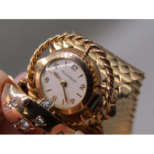 95 - A Jaeger Le Coultre gold bracelet watch in the form of a belt buckle, diamond set to the hinge watch... 