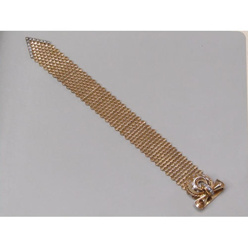 95 - A Jaeger Le Coultre gold bracelet watch in the form of a belt buckle, diamond set to the hinge watch... 