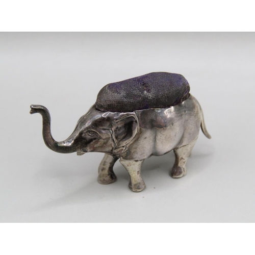 117 - A silver trumpeting elephant pin cushion, Birmingham 1905, 5cm l.