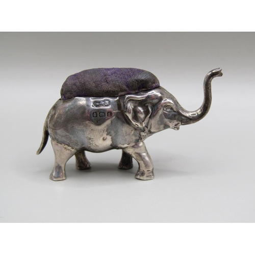 117 - A silver trumpeting elephant pin cushion, Birmingham 1905, 5cm l.