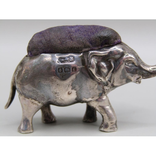 117 - A silver trumpeting elephant pin cushion, Birmingham 1905, 5cm l.