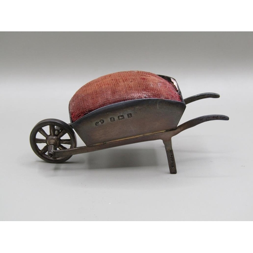 124 - A silver wheel barrow pin cushion, Birmingham 1908, 8.2cm l.