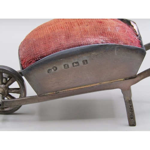 124 - A silver wheel barrow pin cushion, Birmingham 1908, 8.2cm l.