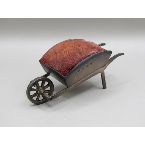 124 - A silver wheel barrow pin cushion, Birmingham 1908, 8.2cm l.