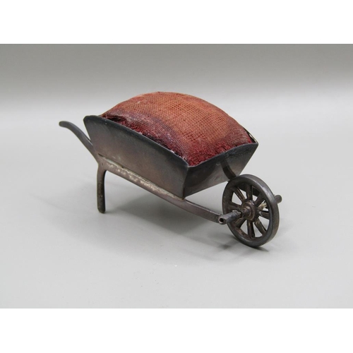 124 - A silver wheel barrow pin cushion, Birmingham 1908, 8.2cm l.