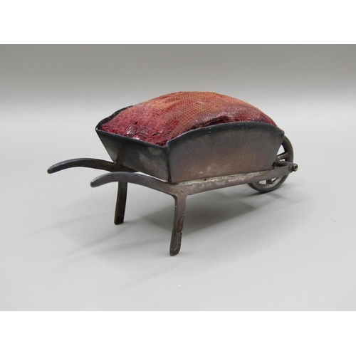 124 - A silver wheel barrow pin cushion, Birmingham 1908, 8.2cm l.