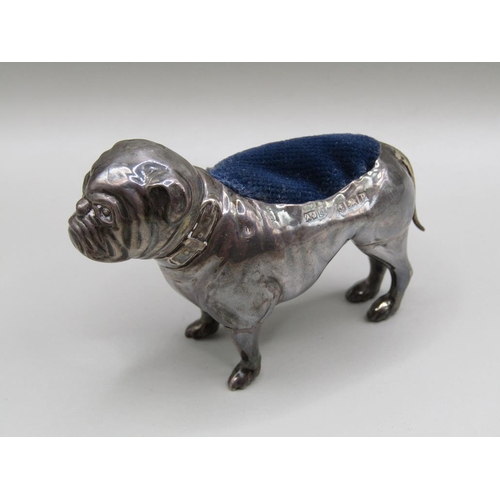 128 - A silver bulldog pin cushion, Birmingham 1914, 7.5cm l.