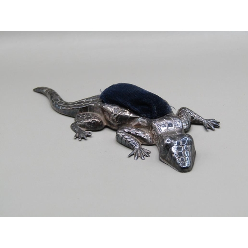 131 - A silver reptile pin cushion, Birmingham 1921, 10cm l.