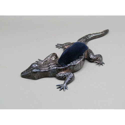 131 - A silver reptile pin cushion, Birmingham 1921, 10cm l.