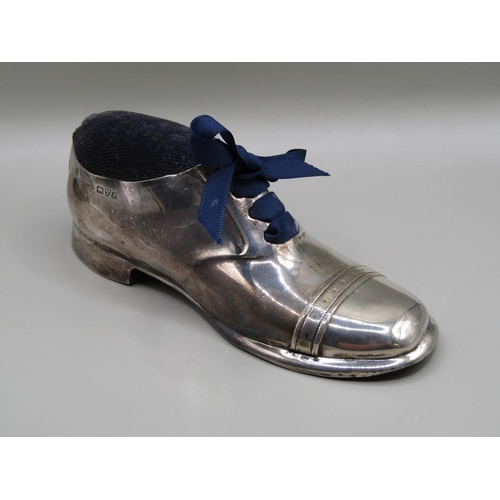 133 - A silver shoe pin cushion, Chester 1909, 13cm l.