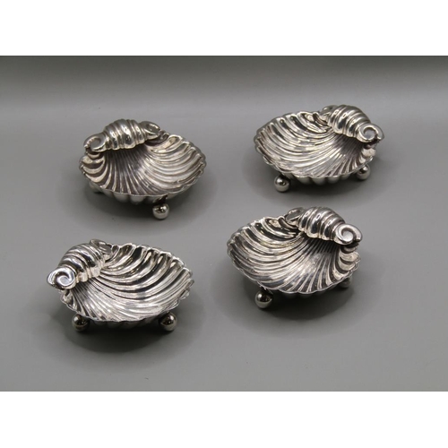 150 - A set of four late 19c silver table salts of shell form, Birmingham 1896, 1.9ozt, each 5.5cm w.