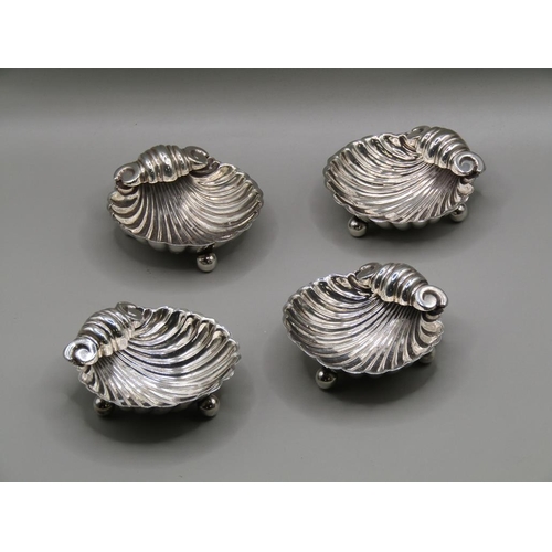 150 - A set of four late 19c silver table salts of shell form, Birmingham 1896, 1.9ozt, each 5.5cm w.