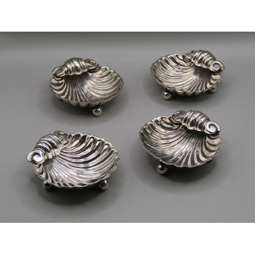 150 - A set of four late 19c silver table salts of shell form, Birmingham 1896, 1.9ozt, each 5.5cm w.