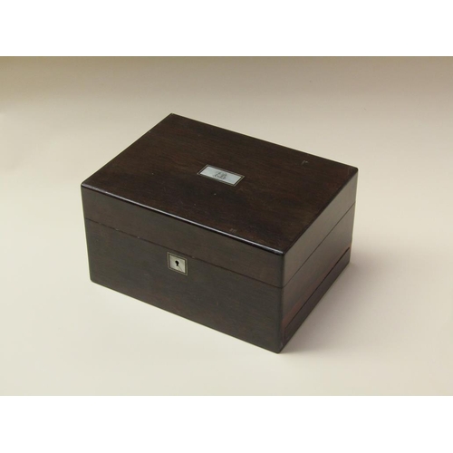 68 - A 19c rosewood ladies vanity box with fitted interior, the hinge cover with rectangular mother of pe... 