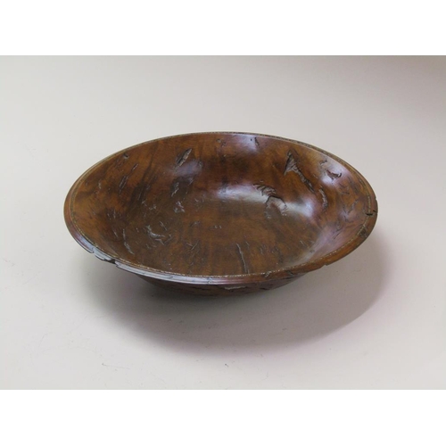 69 - A 19c turned burr wood fruit bowl with a silver chip inlaid border, 32cm diam.