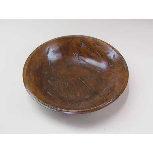 69 - A 19c turned burr wood fruit bowl with a silver chip inlaid border, 32cm diam.