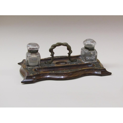 70 - A Victorian walnut brass mounted two bottle inkstand, the central gilt metal carrying handle cast as... 