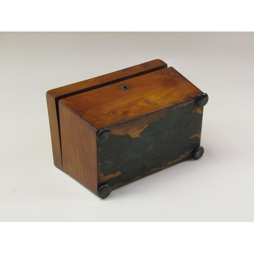 72 - A late Regency mahogany two compartment tea caddy, enclosed by a single hinge cover and supported on... 