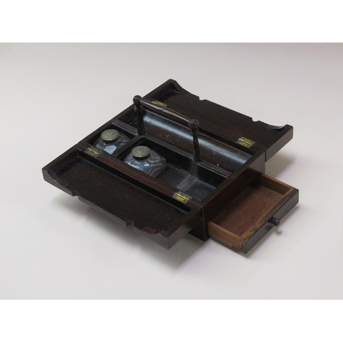 73 - A Regency rosewood writing box, the interior fitted with two cut glass ink bottles, having pen well ... 