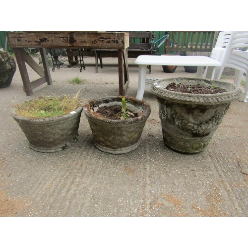 939 - THREE CONCRETE GARDEN PLANTERS