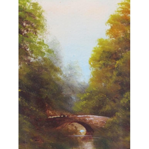 1043 - UNSIGNED LATE 19C - QUIET WATERWAY WITH STONE BRIDGE IN A WOODLAND SETTING, OIL ON BOARD, FRAMED, 45... 