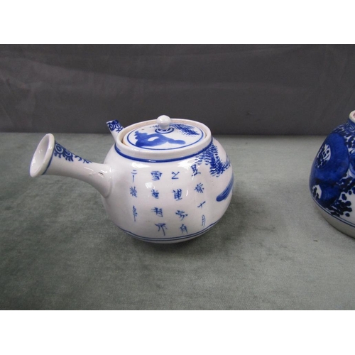 1604 - TWO ORIENTAL PORCELAIN TEAPOTS 9cms H