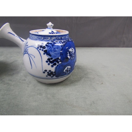 1604 - TWO ORIENTAL PORCELAIN TEAPOTS 9cms H