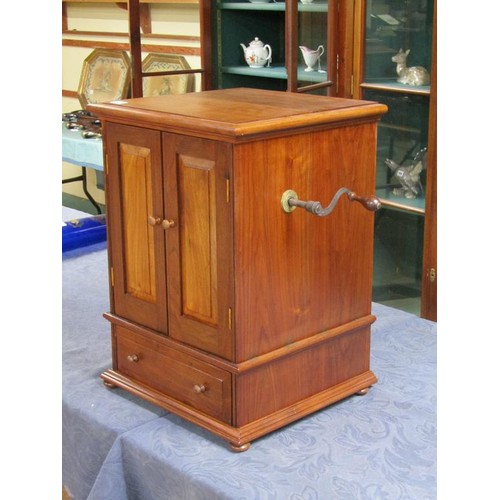 57 - An early 20c German Polyphon by Schutz Marke in a mahogany cabinet case with front opening doors and... 