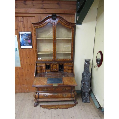 284 - An 18c Dutch style marquetry bureau bookcase, profusely decorated with leaf and flowers, having one ... 