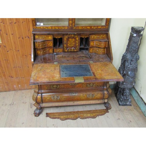 284 - An 18c Dutch style marquetry bureau bookcase, profusely decorated with leaf and flowers, having one ... 