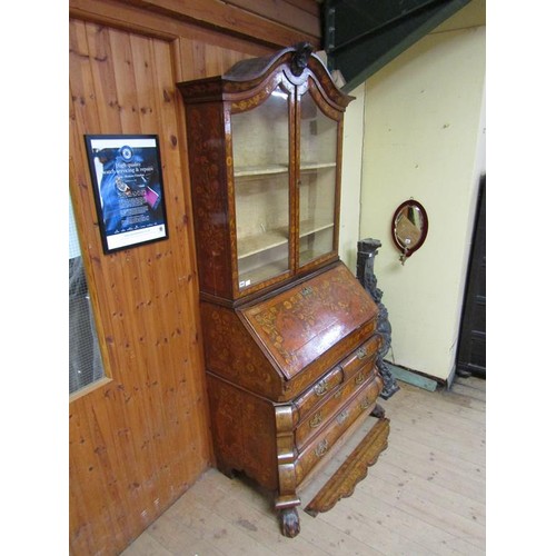 284 - An 18c Dutch style marquetry bureau bookcase, profusely decorated with leaf and flowers, having one ... 