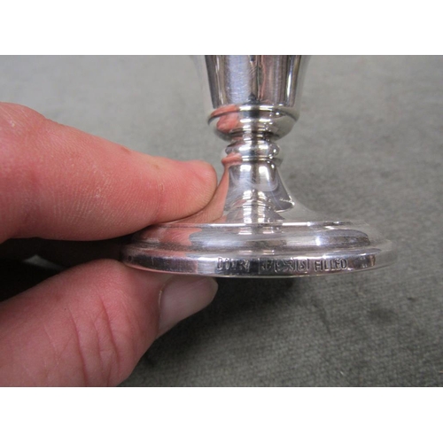 1514 - THREE SETS OF SILVER CASED CANDLESTICKS