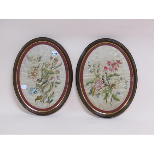 1162 - PAIR OF EARLY 19C SILK WORK PANELS DECORATED WITH LEAF AND FLOWERS, OVAL F/G, 37CM X 28CM