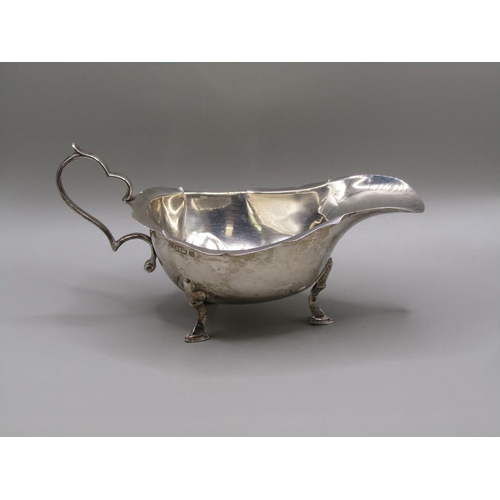 1406 - SILVER GRAVY BOAT AND A PAIR OF SILVER TONGS