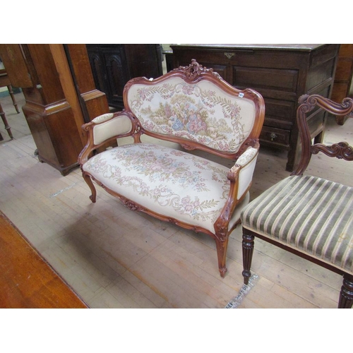 1671 - CARVED SHOW FRAME AND UPHOLSTERD TWO SEATER SOFA