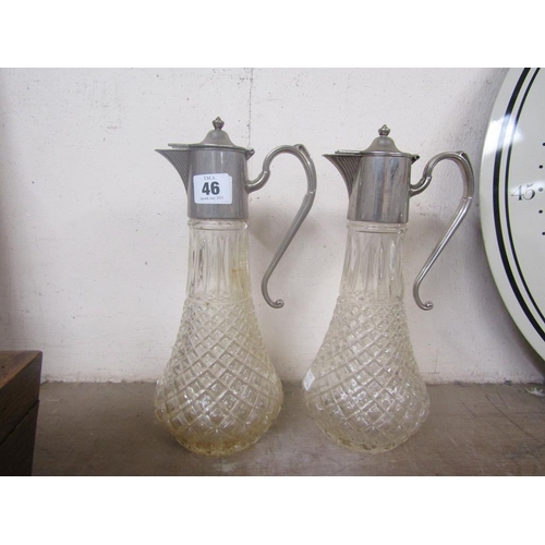 46 - PAIR OF CRYSTAL AND SILVER PLATED MOUNTED CLARET JUGS