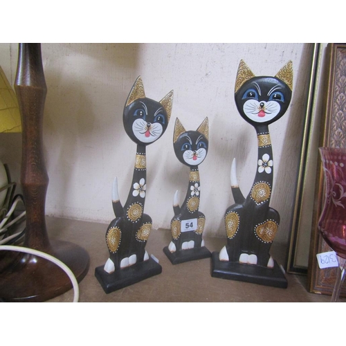 54 - GRADUTAED WOODEN CATS