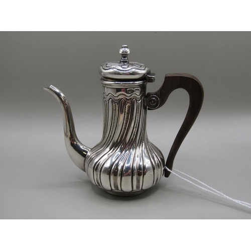 1366 - LATE 19/EARLY 20c CONTINENTAL SILVER MINIATURE COFFEE POT OF EMBOSSED AND CHASED FORM - 9cms H