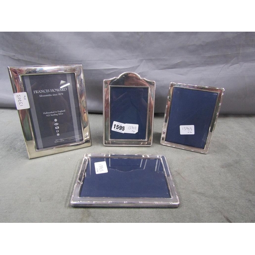 1595 - FOUR SILVER FRAMED PHOTO FRAMES